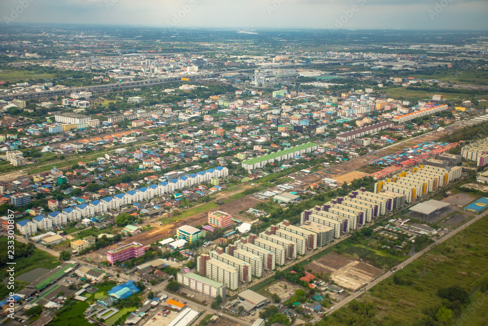 high angle view of condominium building and home village over outskirt of bangkok thailand capital