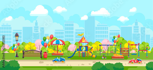 City park with colorful kids playground and bench on background of city buildings