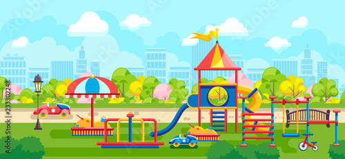 Colorful playground constructions on green meadow in city park on urban background