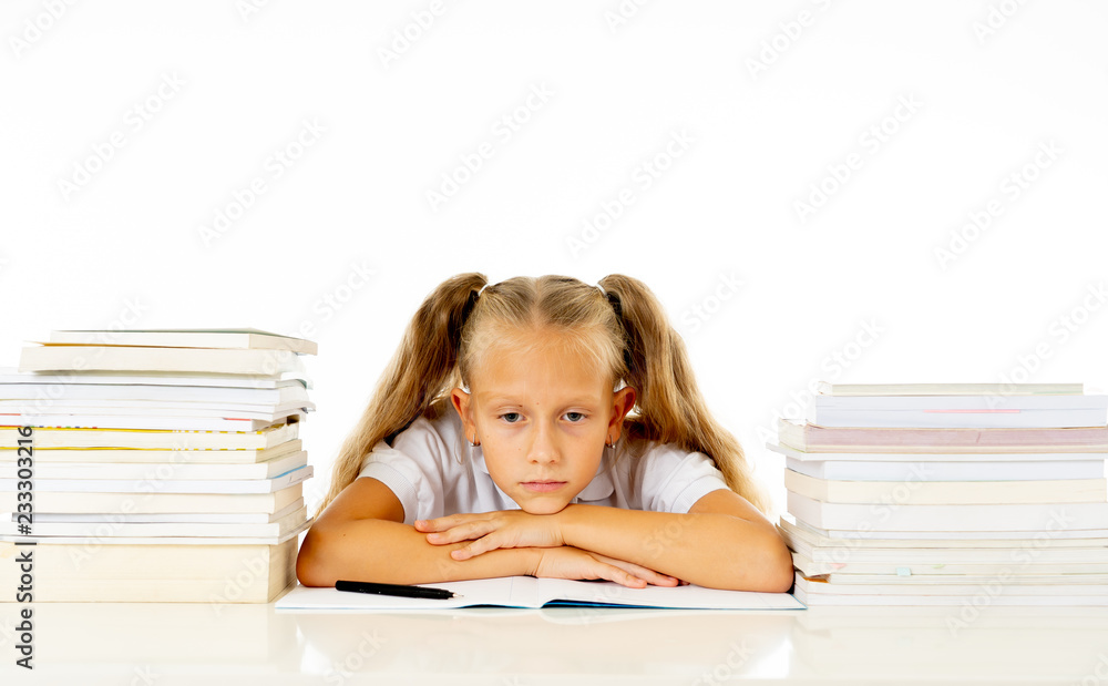 Sad unhappy cute little girl overwhelm with homework and studies Sad unhappy cute little girl overwhelm with homework and studies