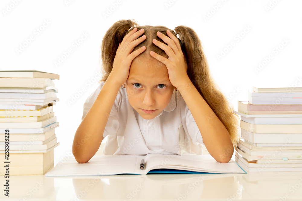 Stressed school girl feeling frustrated and unable to concentrate in her studies Stressed school girl feeling frustrated and unable to concentrate in her studies