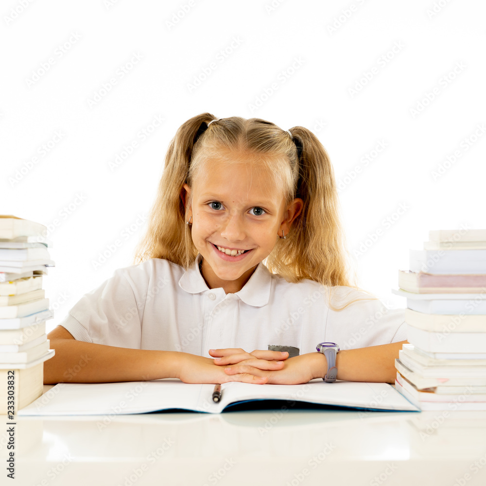 Cute smiling little girl with a pile of books feeling happy Cute smiling little girl with a pile of books feeling happy