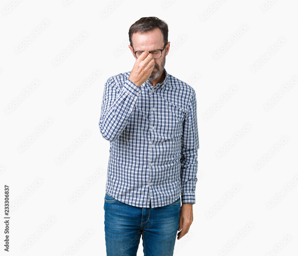 Handsome middle age elegant senior business man wearing glasses over isolated background tired rubbing nose and eyes feeling fatigue and headache. Stress and frustration concept. Handsome middle age elegant senior business man wearing glasses over isolated background tired rubbing nose and eyes feeling fatigue and headache. Stress and frustration concept.