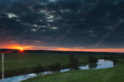 dramatic sky over the river in fog © voven