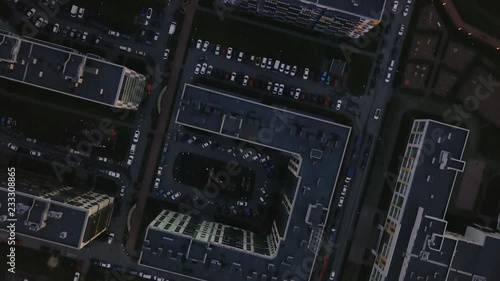 Wallpaper Mural Aerial survey over the roofs of an unfavorable area with dense buildings. top view roof of cars, narrow roads, dirty streets. Sad color of gray city. roof high rises. Aerial footage gray district. Torontodigital.ca