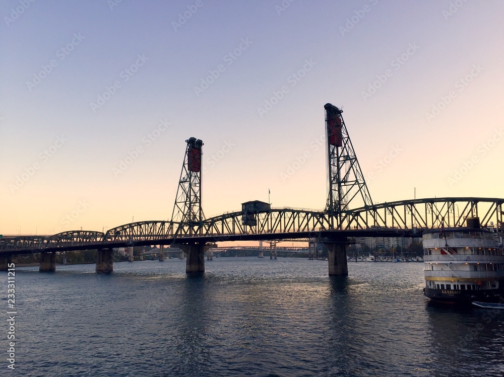 View of the Steel Bridge at dusk in Portland, Oregon View of the Steel Bridge at dusk in Portland, Oregon