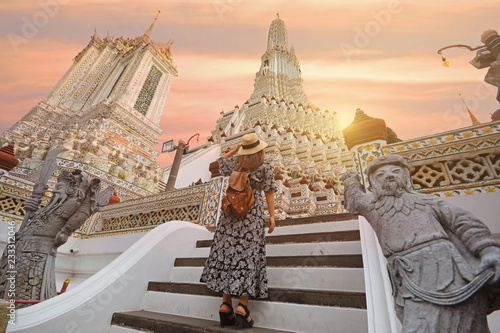 A woman tourist is traveling at Wat Arun in Bangkok  Thailand.