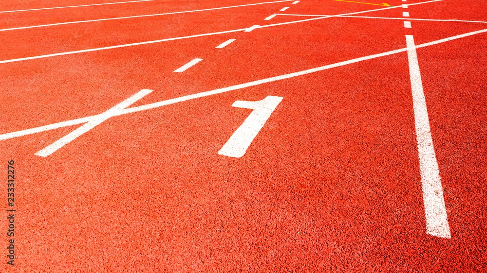 Fototapeta premium number one in red running track on the athletic stadium