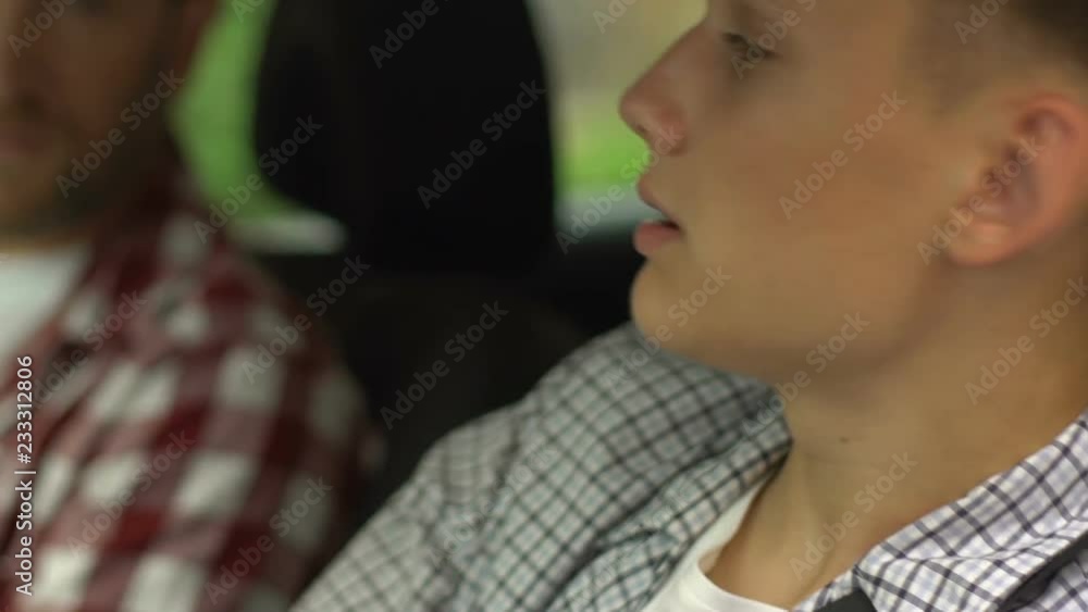 Instructor teaching young man to drive auto, father purchased car for teen son Instructor teaching young man to drive auto, father purchased car for teen son