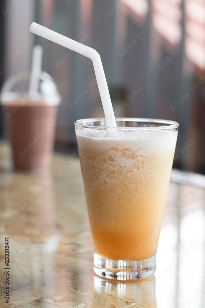 Iced tea drink in coffe shop on wooden desk, Sumer favorite drink Iced tea drink in coffe shop on wooden desk, Sumer favorite drink