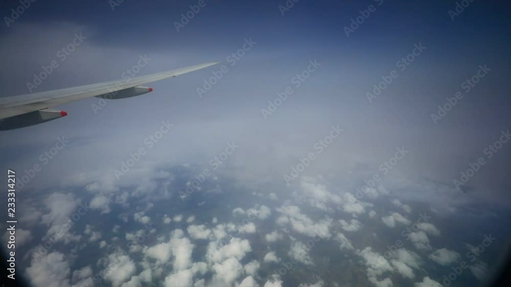 passenger palne flying through rain cloud passenger palne flying through rain cloud