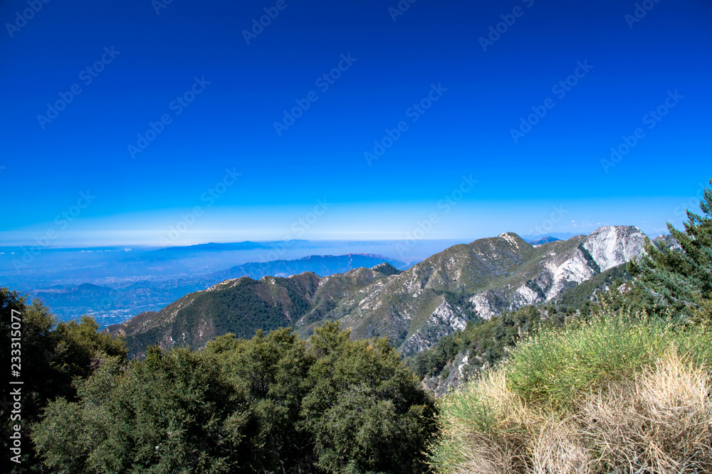 A panorama of the Los Angeles basin through the mist as seen from the San Gabriel Mountains in Cailofrnia