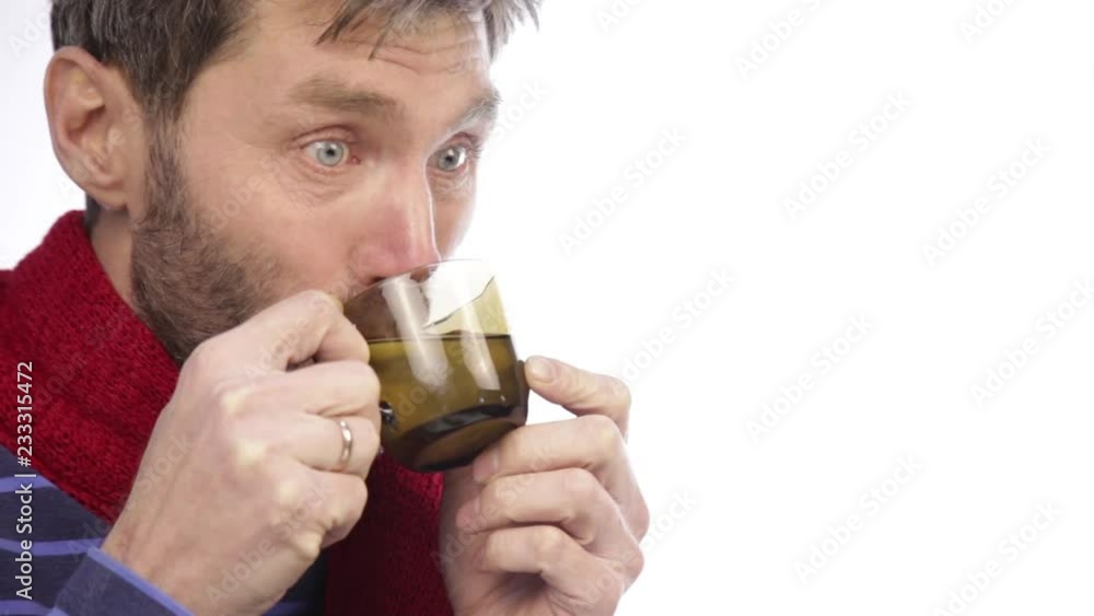 sick bearded hipster with colds and drinks hot tea with lemon sick bearded hipster with colds and drinks hot tea with lemon