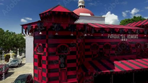 Pan shot of fire station (Parque de Bombas) in Ponce, PR and aerial view of area