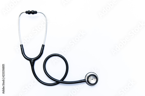 Close up view of black stethoscope on white back