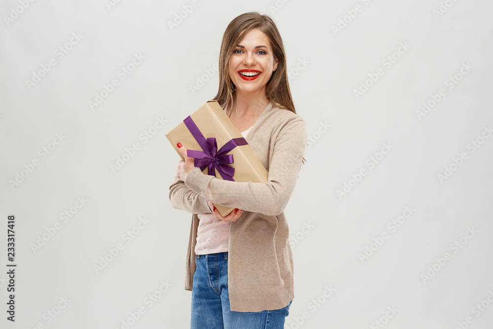 Beautiful woman with long hair standing with gift box. Beautiful woman with long hair standing with gift box.