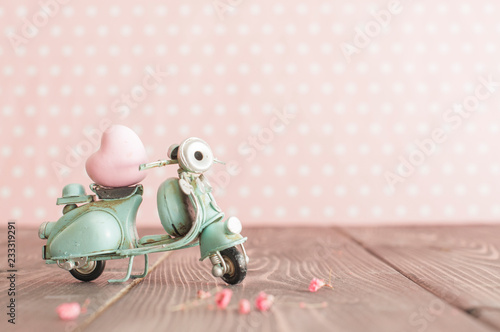 Vintage toy blue mototrcycle with pink heart