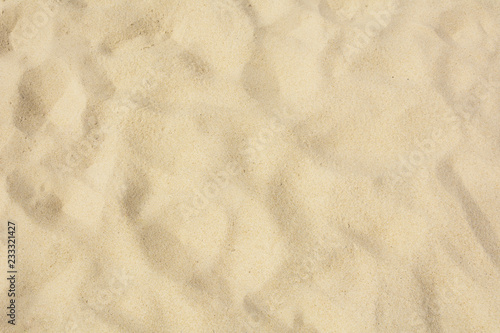 Sand texture on the beach as background.