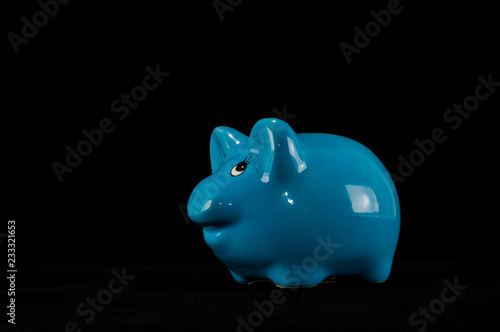 Blue piggy bank or money box isolated photo