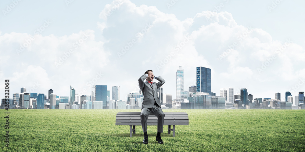 Young man in suit in park dont want to hear anything Young man in suit in park dont want to hear anything