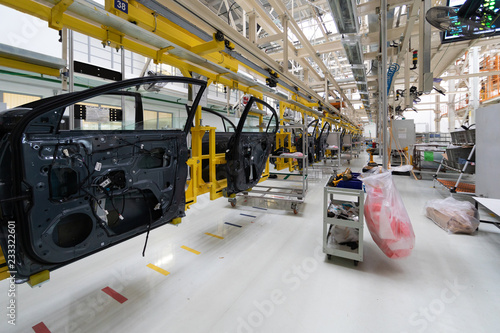 car door on conveyor. Robotic equipment makes Assembly of car. Modern car Assembly at factory © Ivan Traimak