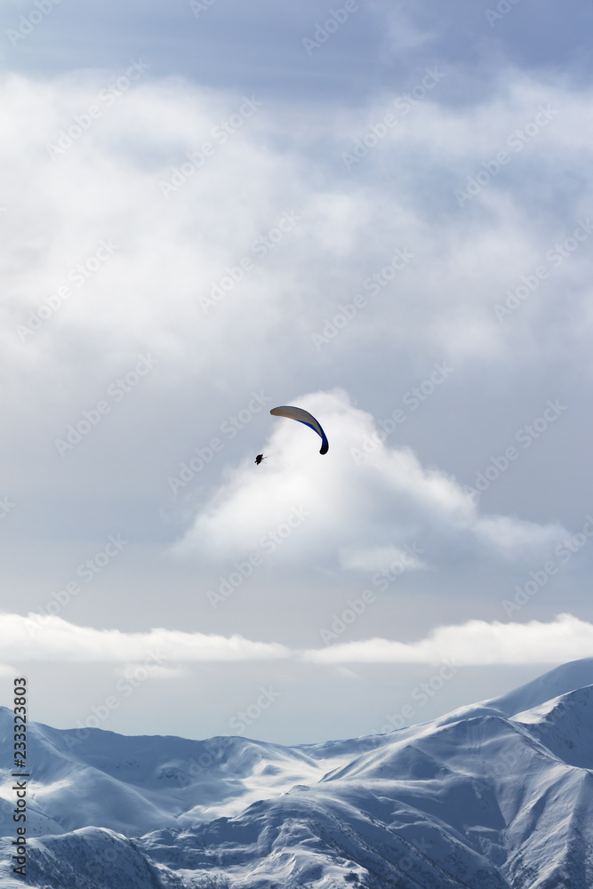 Sky gliding in winter snowy mountains Sky gliding in winter snowy mountains