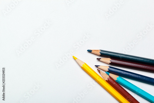 Wooden colorful ordinary pencils isolated on a white background