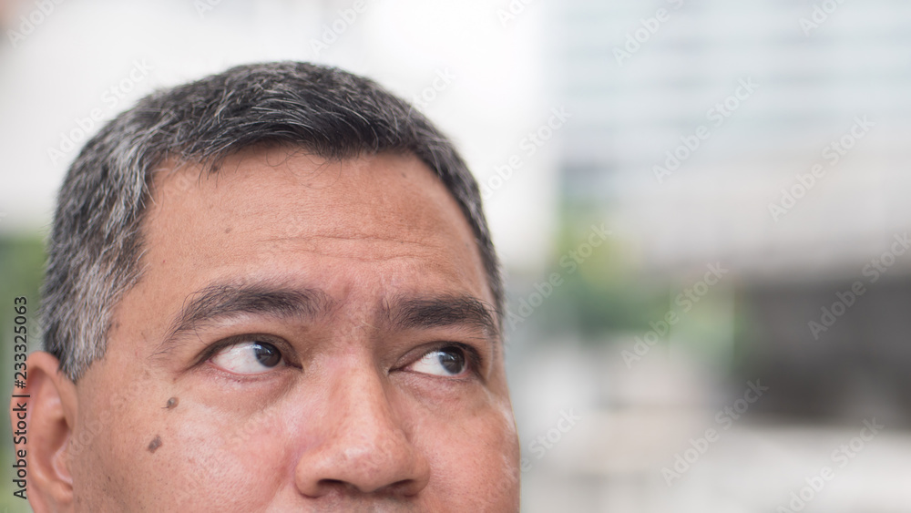 Fototapeta premium senior old business man looking up, watching blank space. portrait of old asian businessman looking at blank content, opportunity, job, work. southeast asian 50s old man model