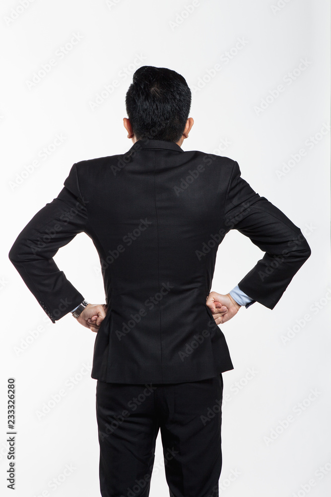 Business man in suit facing back and doing hand gesture Business man in suit facing back and doing hand gesture