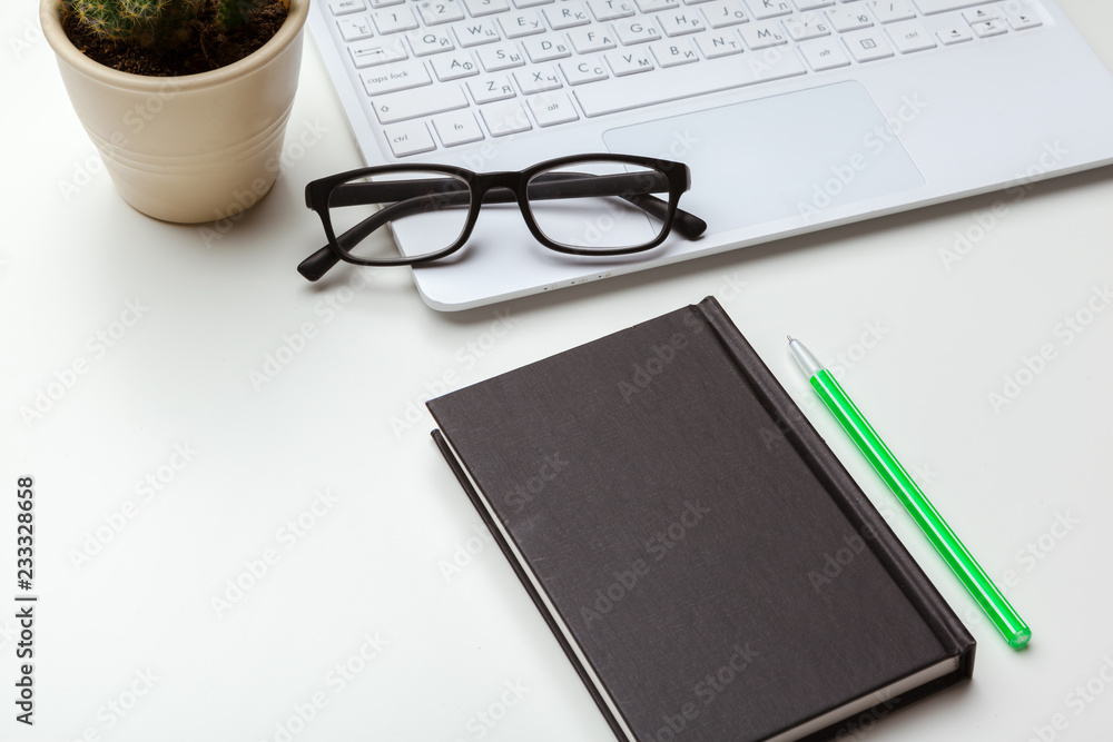 Workplace with notebook laptop. Comfortable work table in office Workplace with notebook laptop. Comfortable work table in office