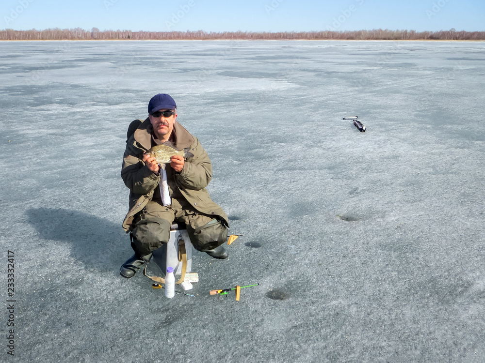 fisherman on winter fishing catch winter sport hobby fisherman on winter fishing catch winter sport hobby