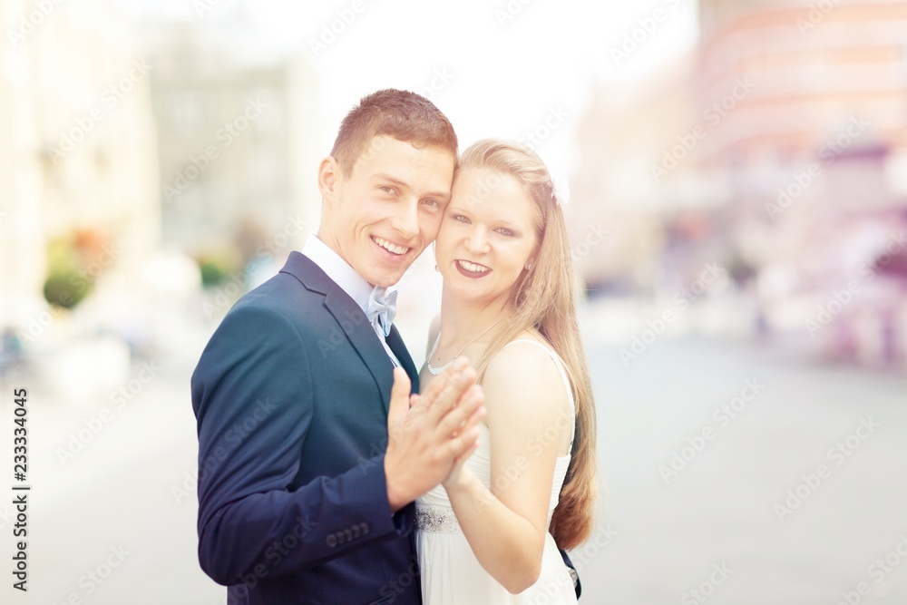 Romantic wedding of bride and groom celebrating marriage in the autumn in city. Romantic wedding of bride and groom celebrating marriage in the autumn in city.