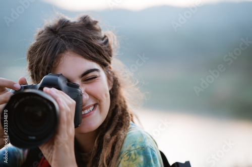 woman hiker alone enjoy the beauty of nature with camera © Odua Images