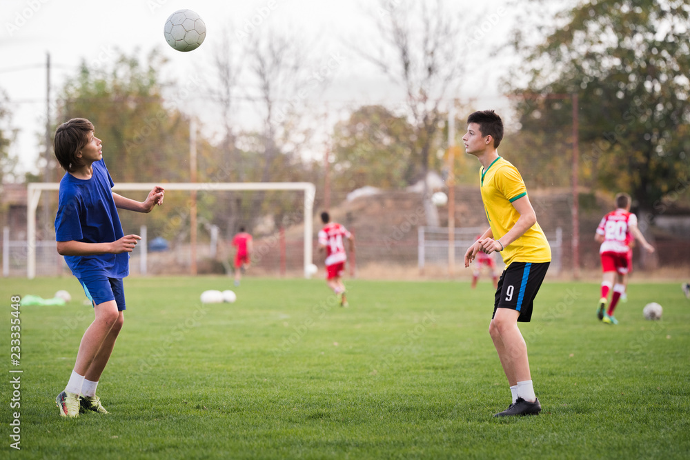 Young children player on the football match