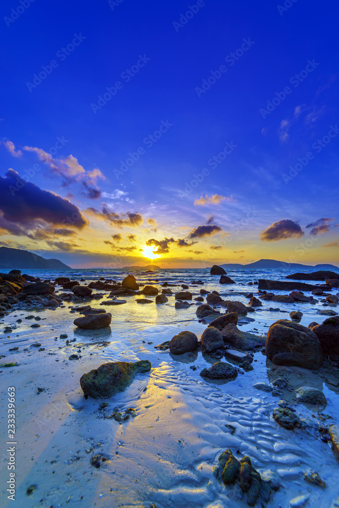 Beautiful colours of clouds and sky during sunrise at Rawai beach, Phuket
