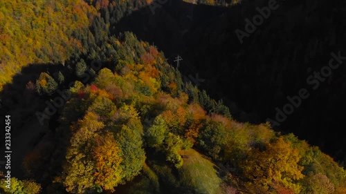 Lonely church on hilltop in picturesque rural Slovenia, 4K aerial drone footage. photo