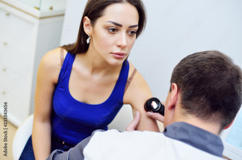 Fototapeta premium Dermatoscopy, prevention of melanoma, skin cancer, Dermatoscope.