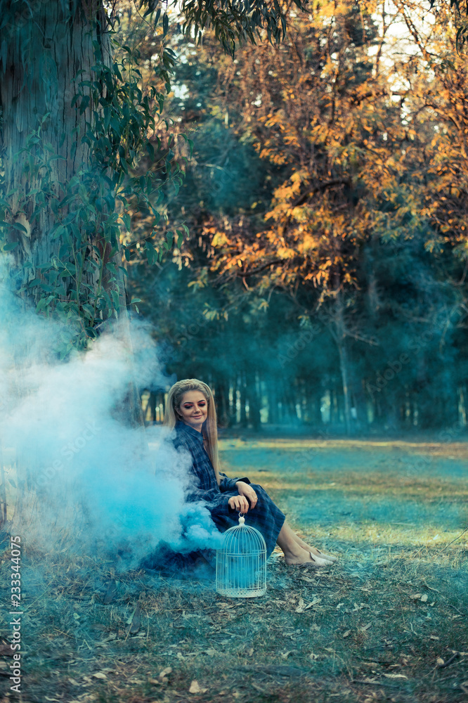 Attractive woman with a colorful smoke grenade bomb fashion Attractive woman with a colorful smoke grenade bomb fashion