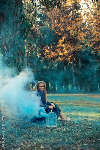 Attractive woman with a colorful smoke grenade bomb fashion