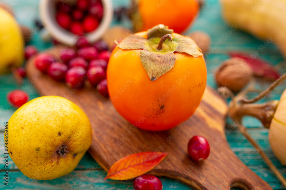 Autumn harvest, fruits and autumn vegetables on a wooden background. Autumn harvest, fruits and autumn vegetables on a wooden background.