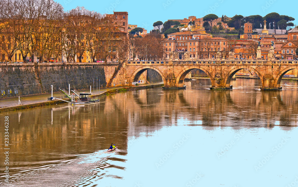 cityscape and panoramic view of old bridge with blue sky water reflections and dome of St. Peters cathedral church with old buildings and architecture in Rome, Italy cityscape and panoramic view of old bridge with blue sky water reflections and dome of St. Peters cathedral church with old buildings and architecture in Rome, Italy
