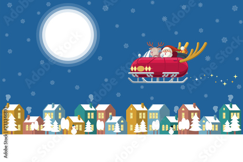 Santa flying sleigh car over winter town at night