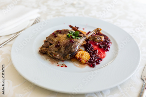 Duck leg confit with mountain cranberries sauce and pear chutney