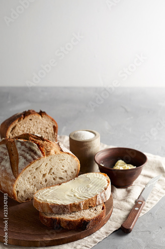 Obraz na płótnie Artisan sliced toast bread with butter and sugar on wooden cutting board w salonie