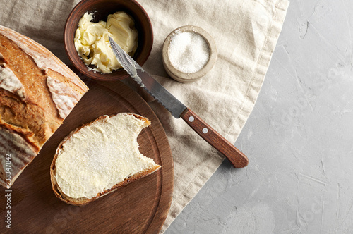 Obraz na płótnie Artisan sliced toast bread with butter and sugar on wooden cutting board w salonie