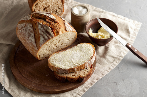 Obraz na płótnie Artisan sliced toast bread with butter and sugar on wooden cutting board w salonie