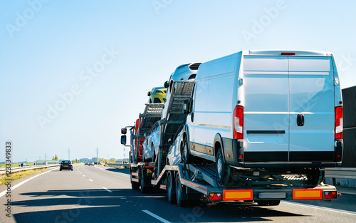 Fotografie, Obraz Truck carrier with mini vans at road of Slovenia
