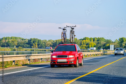 Car with bicycles in highway in Poland concept