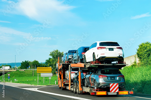 Cars carrier truck in asphalt highway Poland