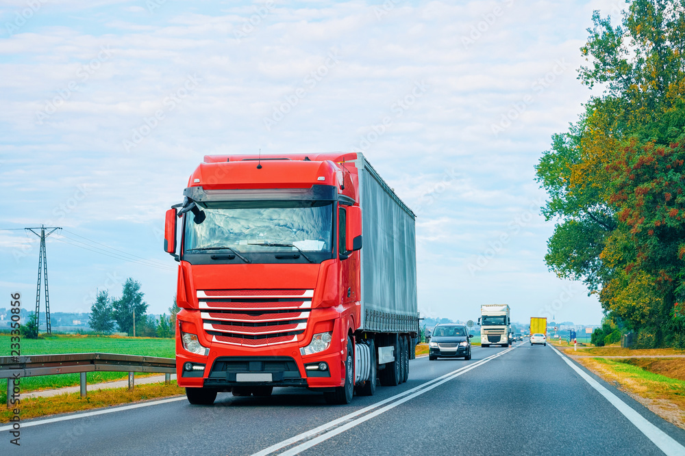 Red Truck in alphalt road in Poland